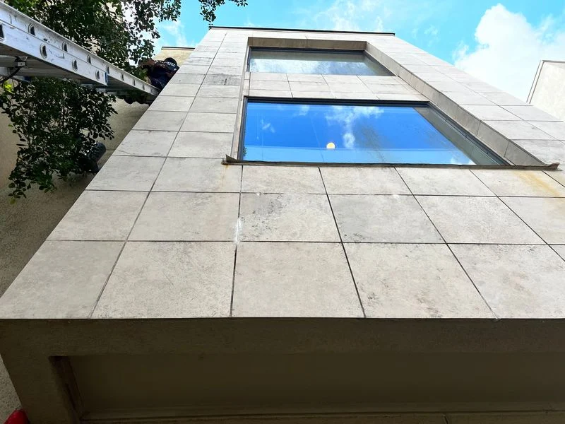 Exterior stucco walls and windows viewed during an assessment